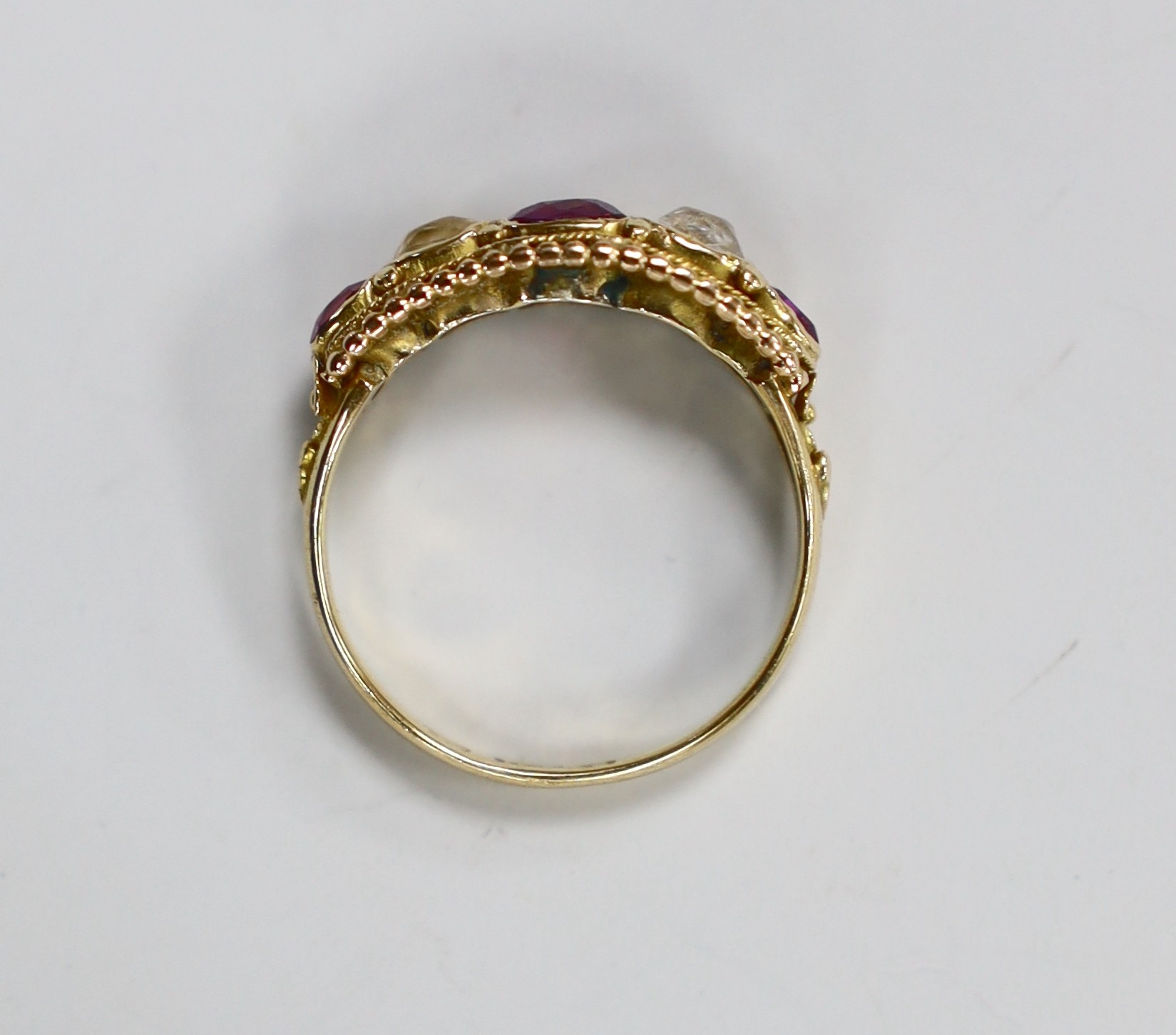 A Victorian 15ct, two stone rock crystal? and three stone garnet set half hoop ring, size L, gross weight 2.2 grams.